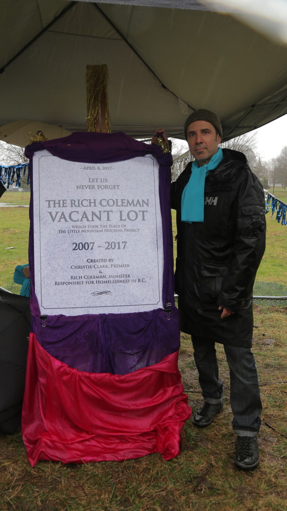 Vaisbord poses next to commemorative plaque at Little Mountain, April 2017